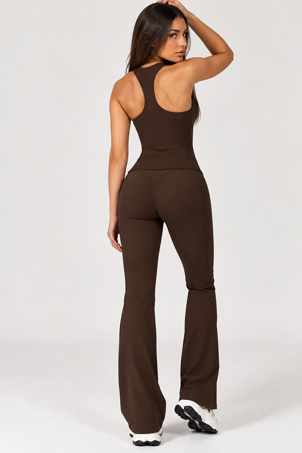 ERAFITT brown women’s fitness outfit with square neck fitted training top and sculpting high waisted crossover leggings, a modern monochrome activewear set for gym workouts, strength training and athleisure