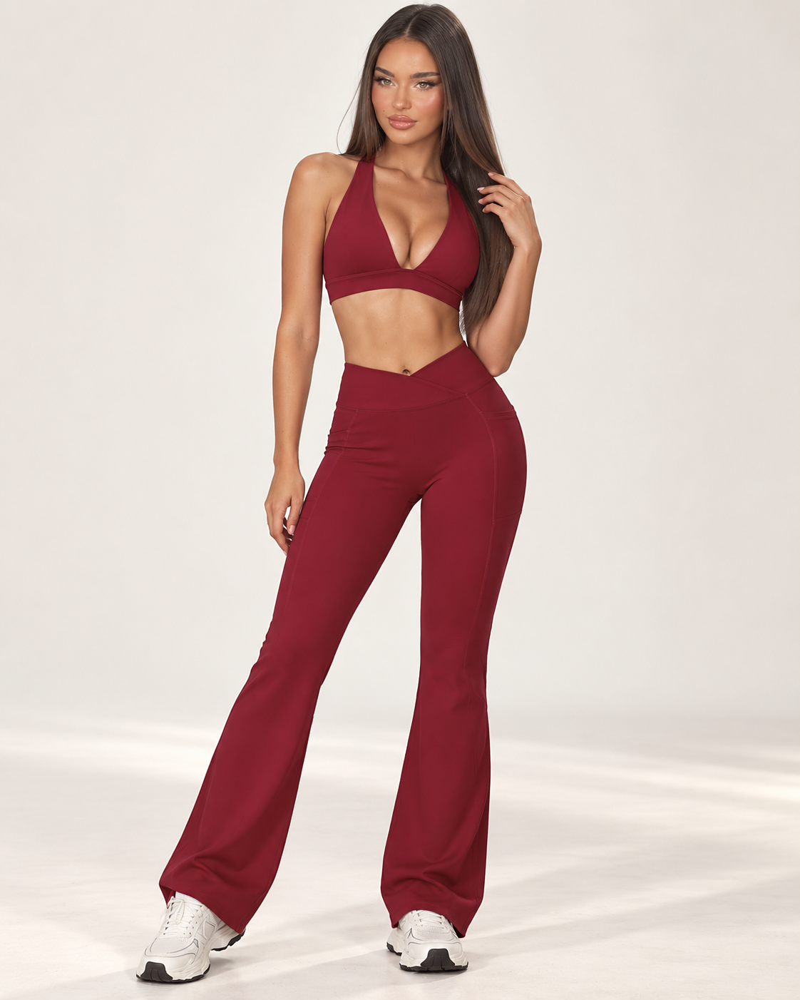 red women’s activewear co ord with a fitted sleeveless square neck training top and full length high waisted sculpting leggings with crossover V waistband, a premium ERAFITT workout and athleisure set