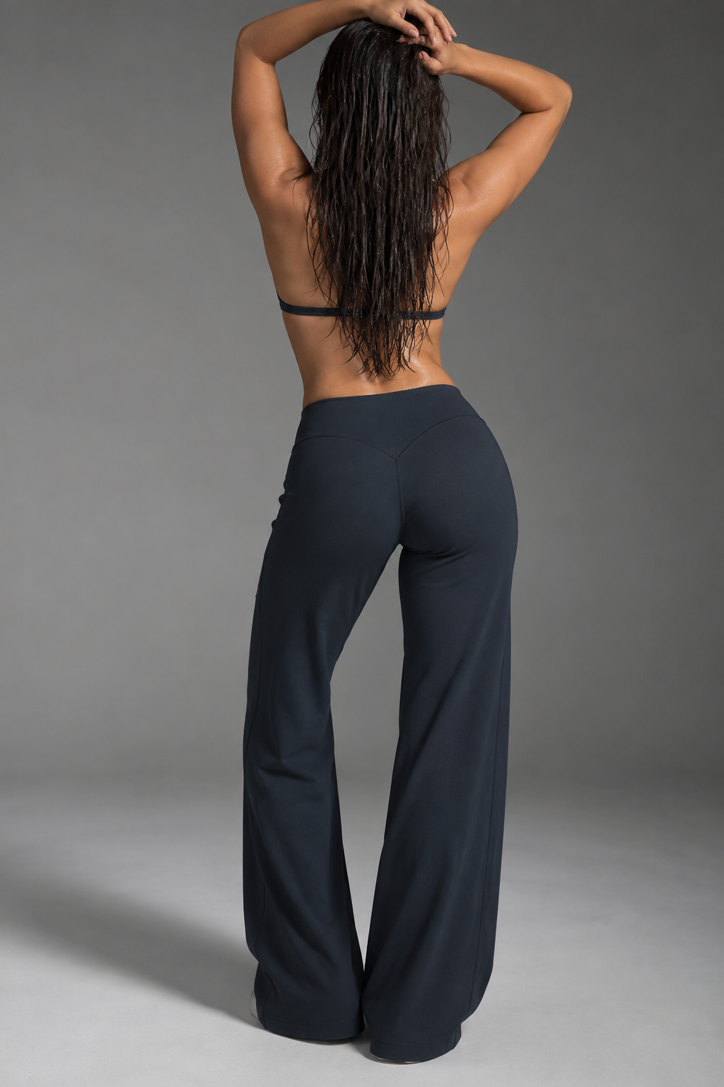 black women’s activewear co ord with delicate halter straps, supportive cropped bra and flowing full length workout trousers