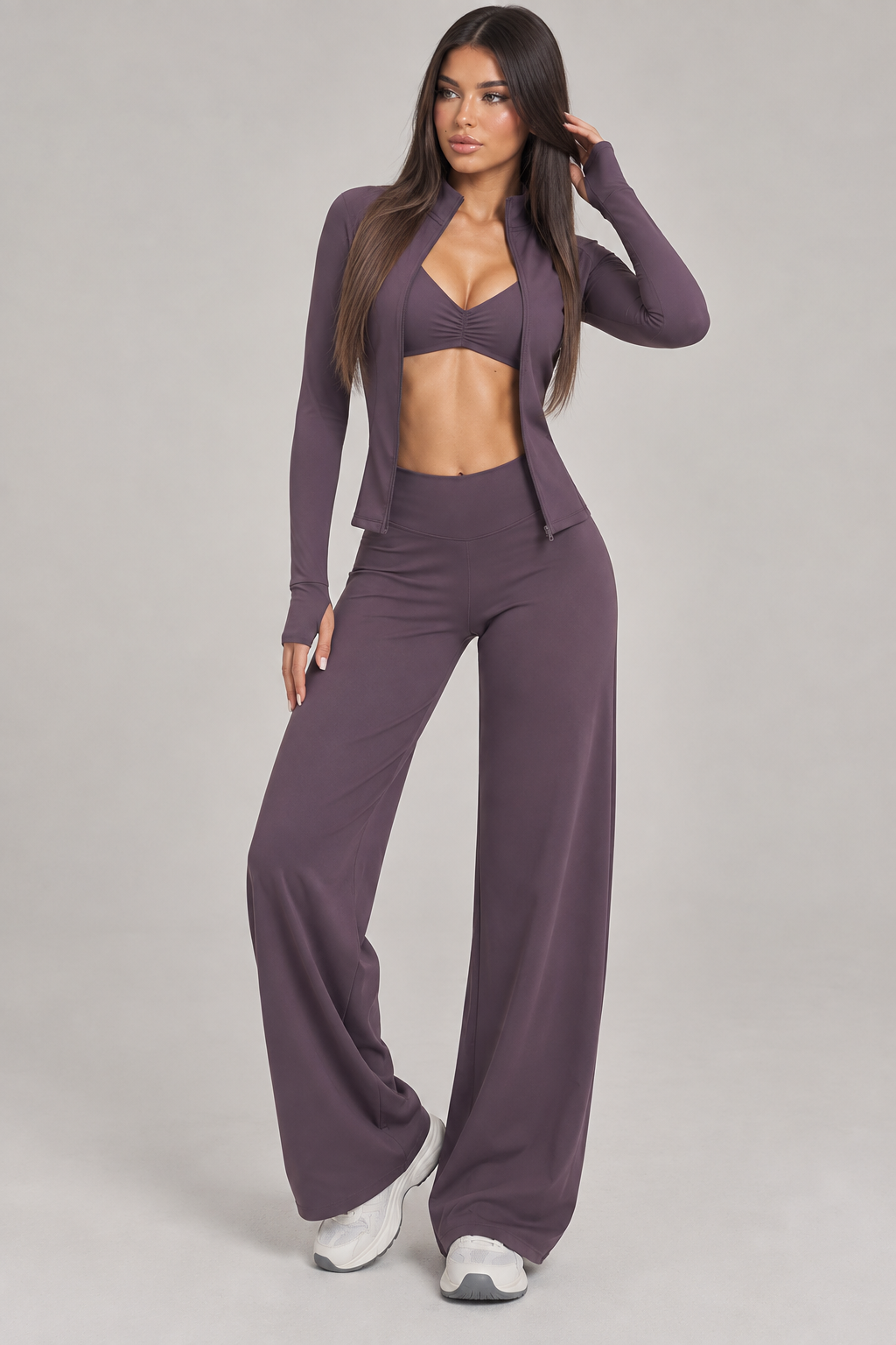 Dusty plum women’s activewear set featuring fitted long sleeve zip jacket and high waisted wide leg workout pants for Pilates, yoga and athleisure