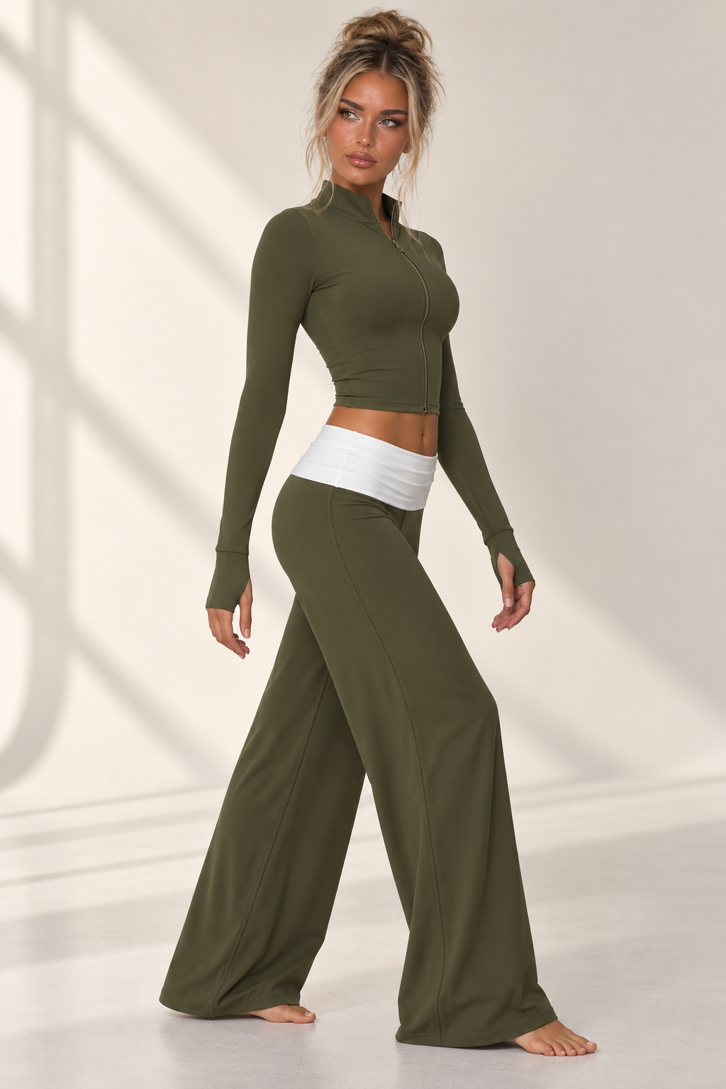 army green women’s Pilates two piece featuring a streamlined cropped athletic jacket and soft draping lounge pants with a statement white waist panel