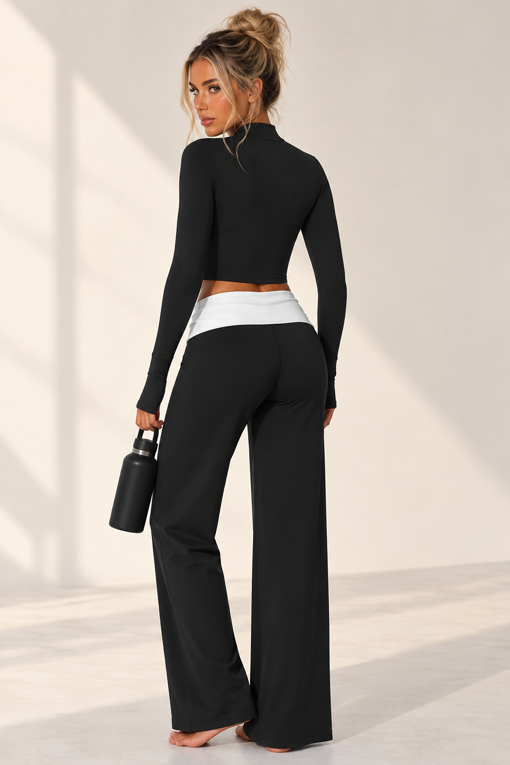 blck women’s Pilates three piece featuring a streamlined cropped performance jacket, matching training bra and fluid wide leg lounge pants