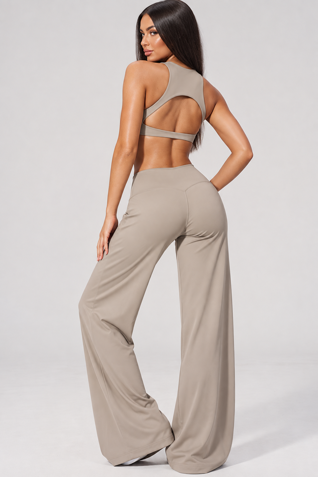 khaki women’s fitness outfit with a fitted sleeveless sports top and high rise wide leg workout pants, a minimalist monochrome activewear set for gym training, Pilates, exercise and everyday athleisure
