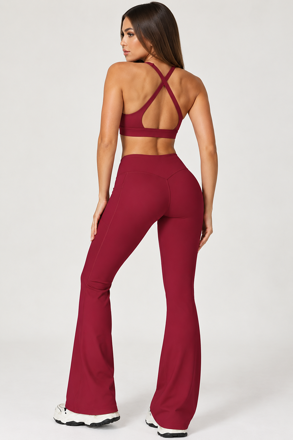 red women’s activewear co ord with a fitted sleeveless square neck training top and full length high waisted sculpting leggings with crossover V waistband, a premium ERAFITT workout and athleisure set