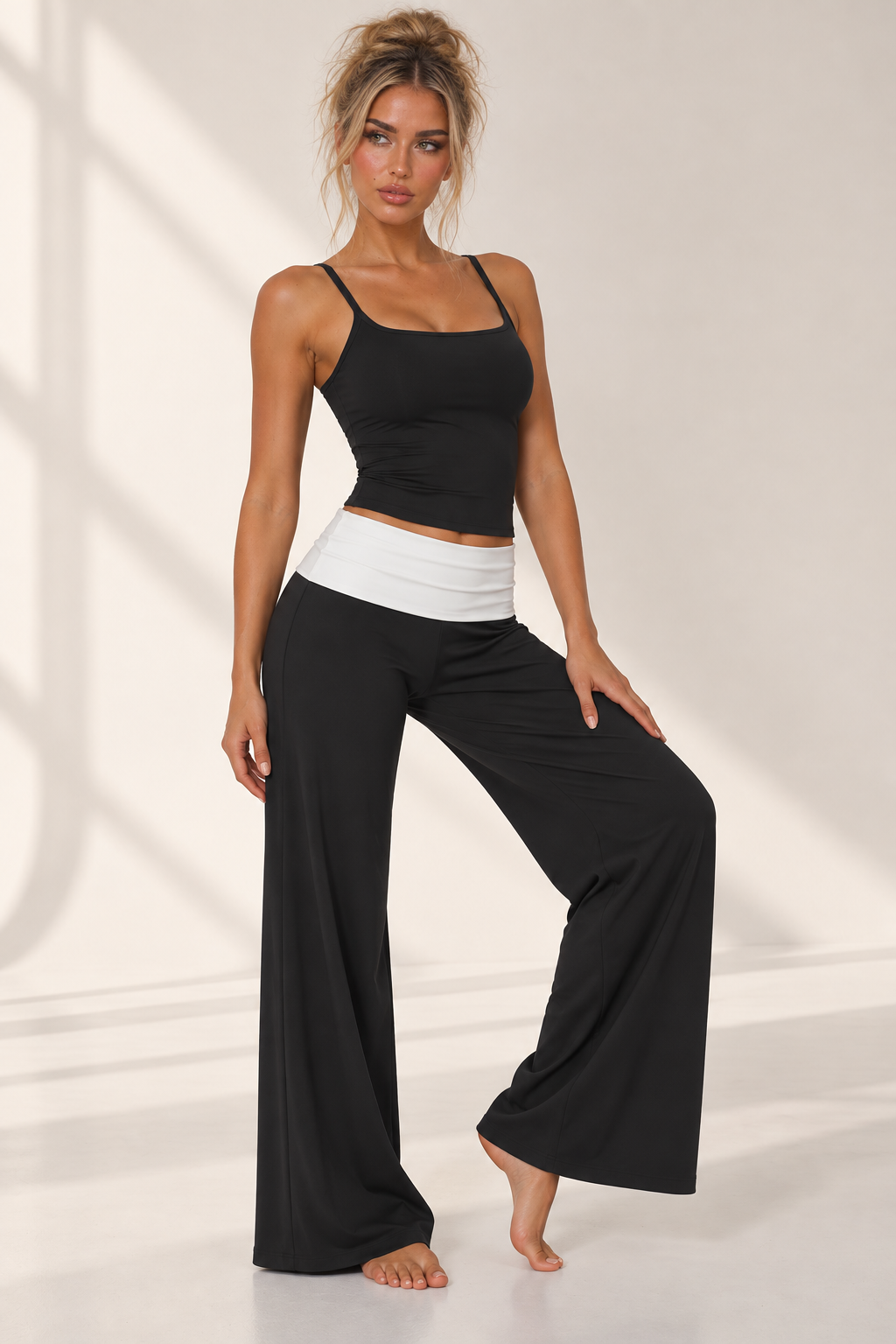 black women’s Pilates three piece featuring a sleek cropped performance jacket, matching training bra and fluid wide leg lounge pants