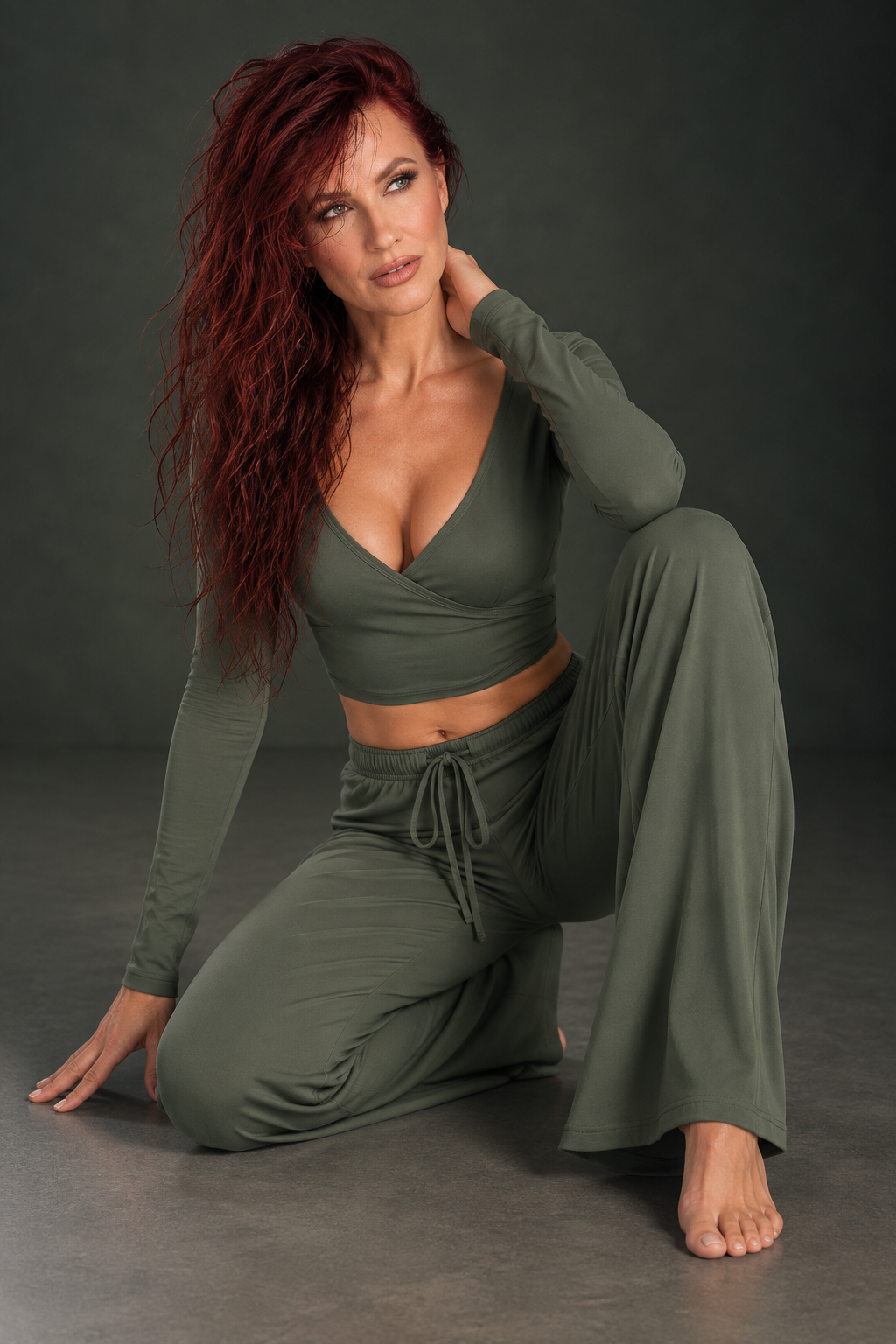 Deep sage women’s Pilates two piece with a feminine back tie top, elastic waist pants and fluid movement friendly fabric